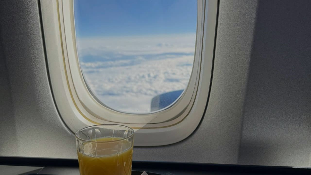 First class airplane cabin with champagne