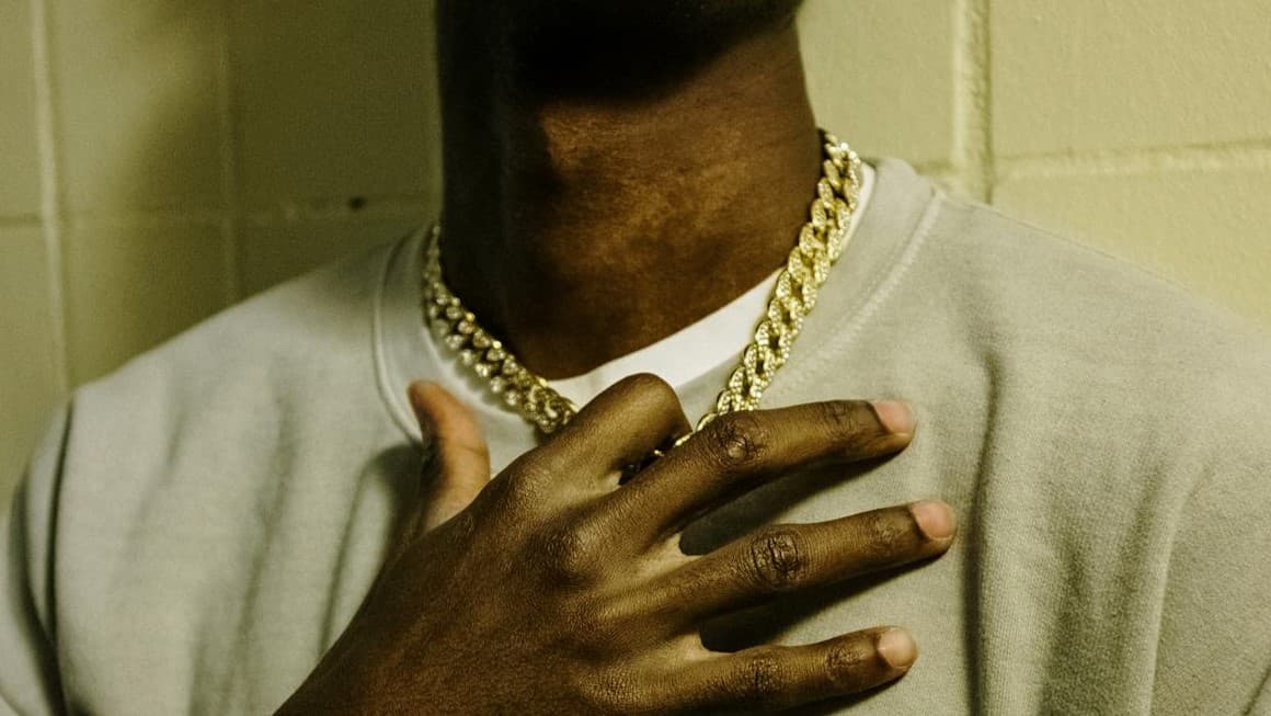 Gold chain jewelry layered on display